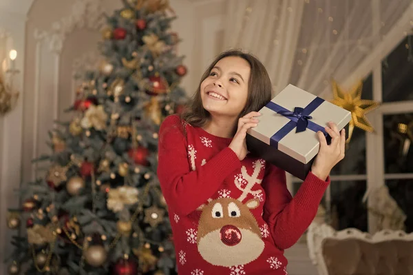 Christmas. Kid enjoy the holiday. The morning before Xmas. New year holiday. Happy new year. little child girl likes xmas present. small happy girl at christmas. Christmas composition — Stock Photo, Image
