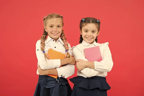 We have all the best stories. Little girls holding books of english literature. Small children enjoying childrens literature. Literature education. Literature lessons at school — Stock Photo, Image