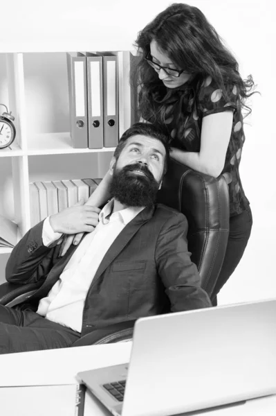 Love is everywhere. Love affair of businessman and sexy woman. Couple in love conducting affair at work. Boss and secretary having love relationship. Bearded man flirting with sensual woman in office