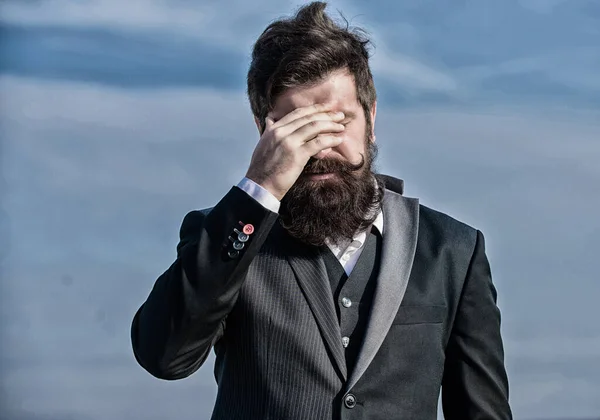 Unforgivable mistake. Business failure. Man bearded stressful painful face sky background. Guy suffer headache stressful day. Stressful business. Pain and migraine. Frustration and disappointment
