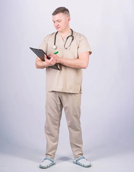 pediatrician intern. Medical tool. confident doctor with stethoscope. nurse laboratory assistant. family doctor. medicine and health. man in medical uniform. Treatment prescription. doctor at work