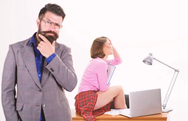 Sexy lady office worker. Sexy personal secretary. Full of desire. Having crush at work boost sexual desire. Bearded boss stand in front of sexy girl working laptop. Office manager or secretary