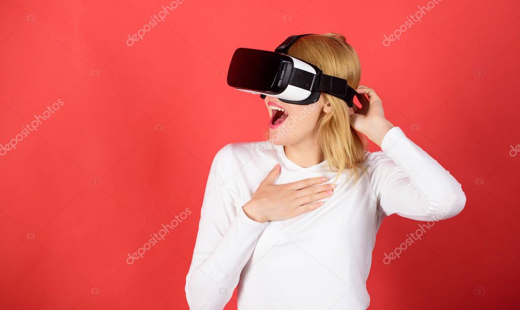 Pretty woman playing game in virtual reality glasses. The woman with glasses of virtual reality. Woman using VR device. Woman with oculus.