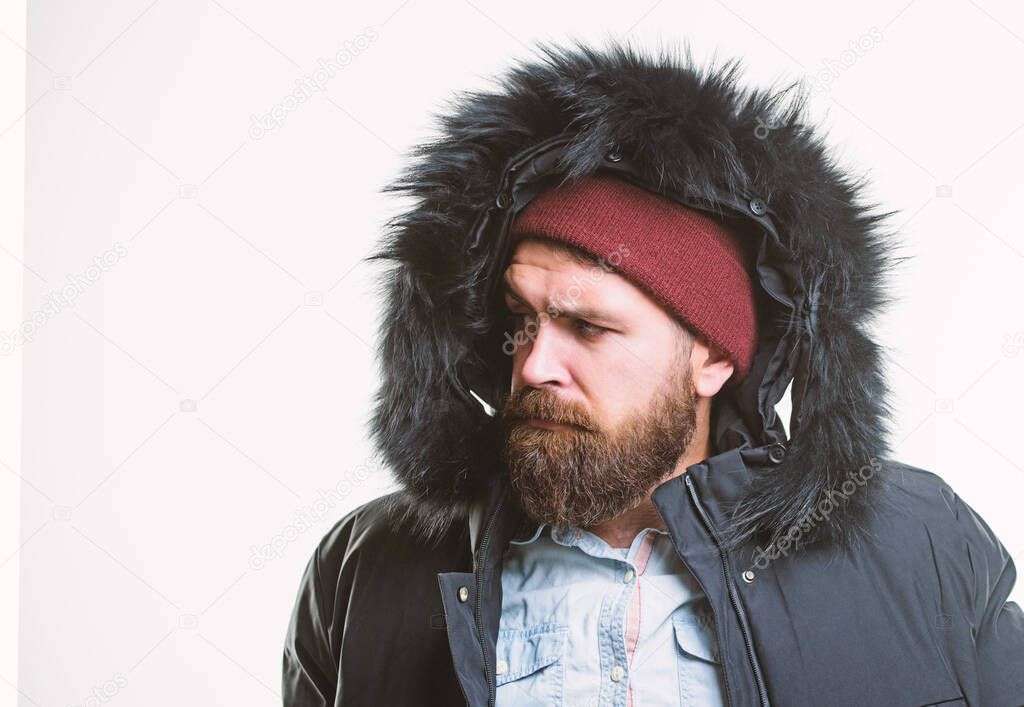Man bearded stand warm jacket parka isolated on white background. Winter outfit. Hipster winter fashion. Guy wear black winter jacket with hood. Prepared for weather changes. Winter stylish menswear