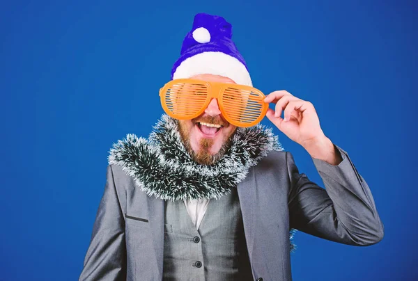 Christmas party office. Corporate holiday party ideas employees will love. Corporate christmas party. Man bearded hipster wear santa hat and funny sunglasses. Manager tinsel ready celebrate new year