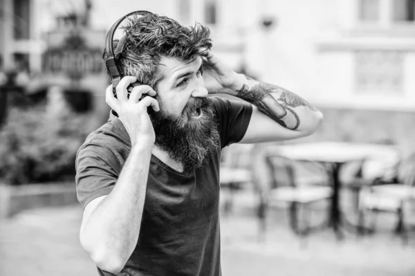 Hipster enjoy excellent sound song in earphones. Walking with music. Music beat for energetic mood. Rhythm for walk. Man bearded hipster headphones listening music. Excellent music playlist — Stock Photo, Image