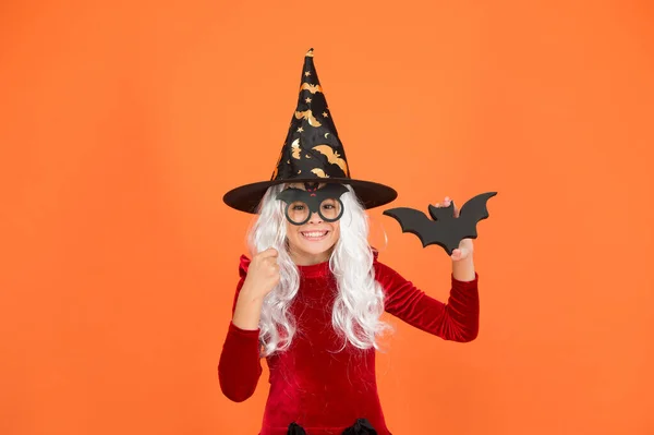 Wizard or magician. Halloween party. Photo booth props. Small girl in black witch hat. Autumn holiday. Join celebration. Little child in witch costume. Magical spell. Small witch with white hair — Stock Photo, Image
