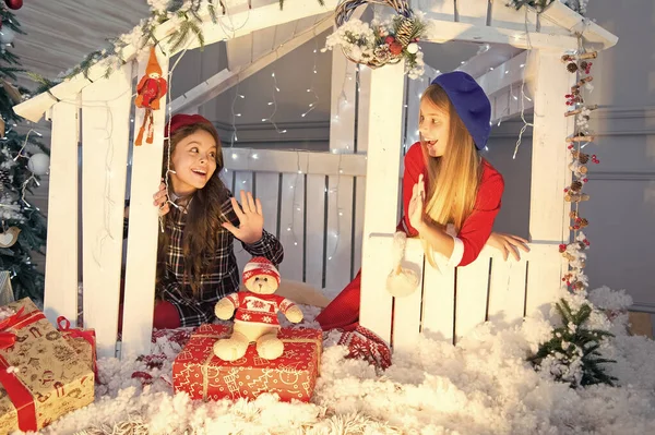 New dreams and new joys. Little children with toy and Christmas gifts. Celebrating Boxing day. New year surprise. Boxing day is the day after xmas. Happy children sit in house with xmas decoration — Stock Photo, Image