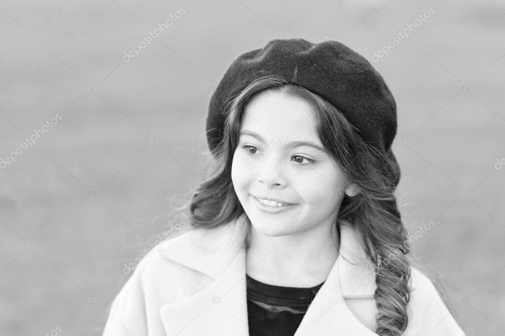 So beautiful. autumn fashion style. fall season. happy childhood. small child with curly hair. parisian girl kid in french beret. beauty and fashion. autumn coat. cheerful little girl in yellow coat