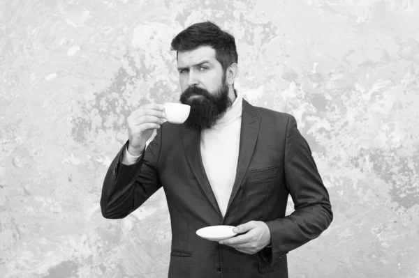 Coffee break concept. Business people fashion style. Smart casual style clothes for office life. Best coffee served for him. Specialty coffee. Man handsome bearded businessman hold cup of coffee