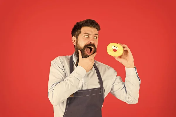 Dessert made with passion. Professional baker enjoy baking doughnut dessert. Bearded man having fun with sweet baked pastry dessert. The best dessert under the sky