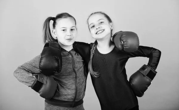 You can do it workout of small girls boxer in sportswear. Fitness diet. energy health. punching knockout. Childhood activity. Sport success. Friendship. Happy children sportsman in boxing gloves