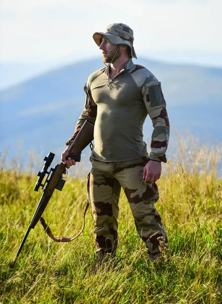 Poacher. war time. soldier in service. weapon shop concept. weapon permit. hunter in camouflage. security of democracy. defender of motherland. man with gun. military male fashion