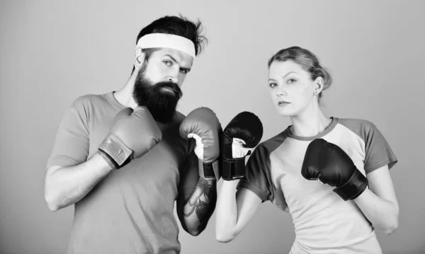 One spirit, one team, one win. punching, sport Success. sportswear. Fight. training with coach. Happy woman and bearded man workout in gym. knockout and energy. couple training in boxing gloves