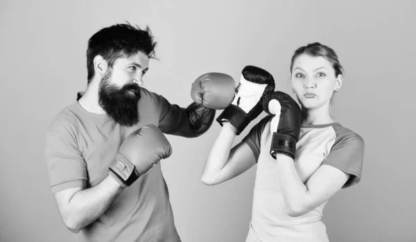 Amateur boxing club. Equal possibilities. Strength and power. Man and woman in boxing gloves. Be careful. Boxing sport concept. Couple girl and hipster practicing boxing. Sport for everyone