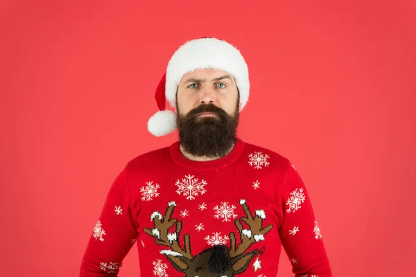 Ready to meet Santa. Hipster man in red santa hat. Winter holidays. New year party. Bearded Santa man on red background. Traditional xmas outfit. Barbershop and winter facial care. Santa is coming — Stock Photo, Image
