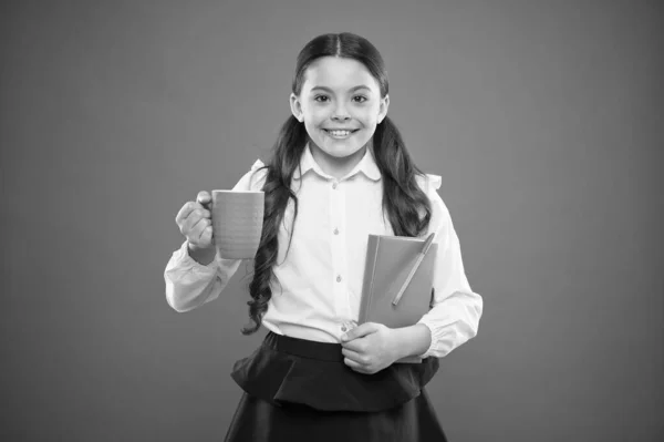 Calories fuel for brain. Girl drink cocoa or tea. Schoolgirl with mug having tea break. Relax and recharge. Water balance. Enjoying tea before school classes. Drink enough water. Inspiring drink — Stock Photo, Image