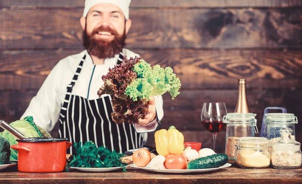 Detox diet. Dieting organic food. Healthy food cooking. Mature hipster with beard. Cuisine culinary. Vitamin. Vegetarian salad with fresh vegetables. Happy bearded man. chef recipe