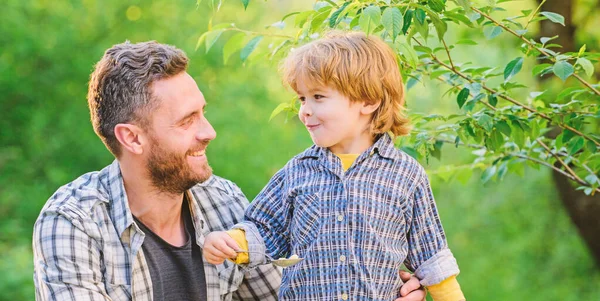 Little boy and dad eat. Everything is more fun with father. Organic nutrition. Healthy nutrition concept. Nutrition habits. Kid hold spoon. Family enjoy homemade meal. Nutrition kids and adults — Stock Photo, Image