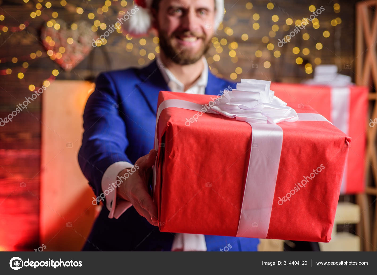 Man formal suit hold gift box. Christmas gift from colleague. Tradition  giving gifts. Businessman excited face hold gift box. Secret santa office  tradition. Celebrate christmas corporate party Stock Photo by ©stetsik  314404120