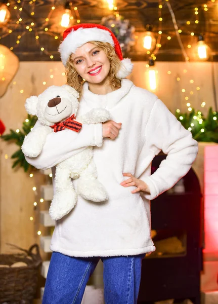 Plan where and how you are going to spend new year eve. Woman with teddy bear toy christmas decorations background. Plan for some interesting Christmas activity. Things to do before christmas