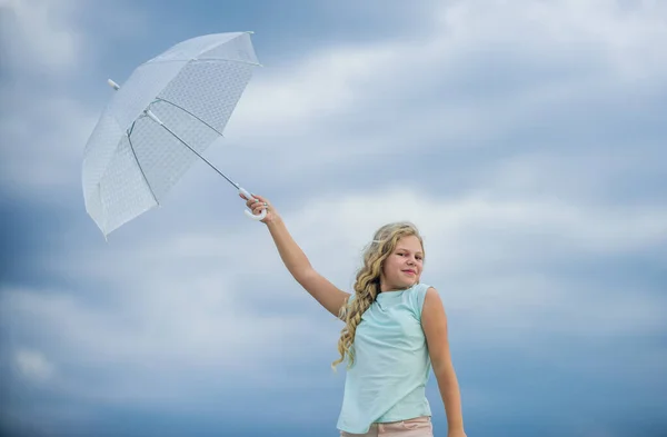 Freedom and freshness. Happy childrens day. Enjoying ease. Carefree child outdoors. Weather forecast. Ready for any weather. Weather changing. Fresh air. Girl with umbrella cloudy sky background — Stock Photo, Image