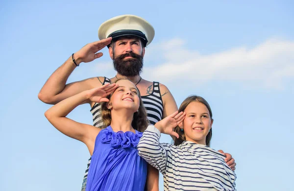 welcome on board. small girls marine fashion. parenting discipline. sea cruise. have good swim. bearded sailor with kids. father back home. family day. dad and daughters outdoor. ship captain salute