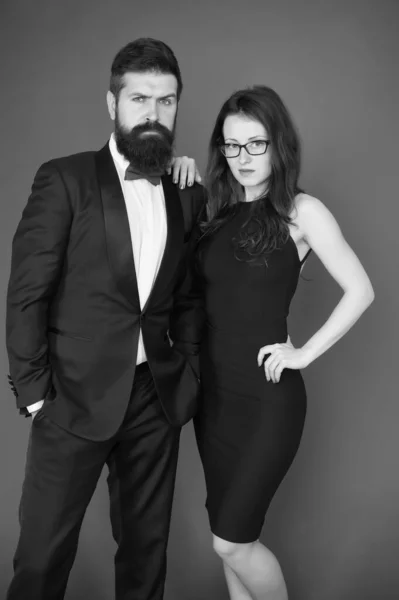 He will melt your heart. Bearded man and woman dating. couple in love on date. Formal couple of man in tuxedo and sexy woman. romantic date. formal fashion look. Proposal or engagement party. Romance