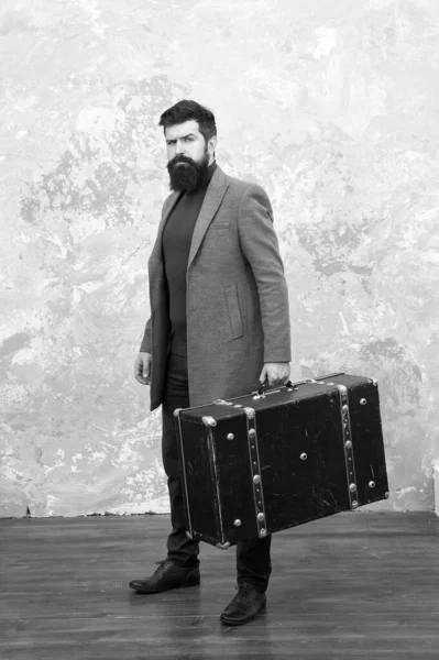 Luggage insurance. Man well groomed bearded hipster with big suitcase. Travel and baggage concept. Hipster traveler with baggage. Ready for relocation with baggage. Start journey. On way to new life