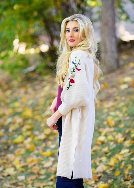 Autumn fashionable cardigan. Girl stylish outfit with soft wool or cashmere cardigan. Woman wear long knitted cardigan while walk in park. Fall fashion cozy cardigan. Feel so warm and comfortable