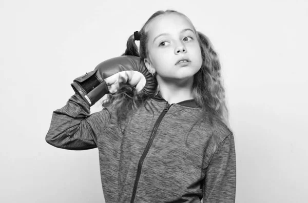 Sport upbringing. Skill of successful leader. Girl cute child with red gloves posing on white background. Sport upbringing for leader. Cute kid with sport boxing gloves. Boxing sport for female — Stock Photo, Image