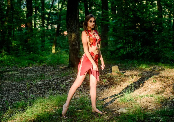 Female spirit mythology. Wild woman in forest. Sexy girl early stage in the evolutionary development. Culture of wild human. Fashion primitive design. Forest fairy. Living wild life untouched nature