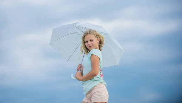 Happy childrens day. Enjoying ease. Carefree child outdoors. Girl with umbrella cloudy sky background. Freedom and freshness. Weather forecast. Ready for any weather. Weather changing. Fresh air — Stock Photo, Image