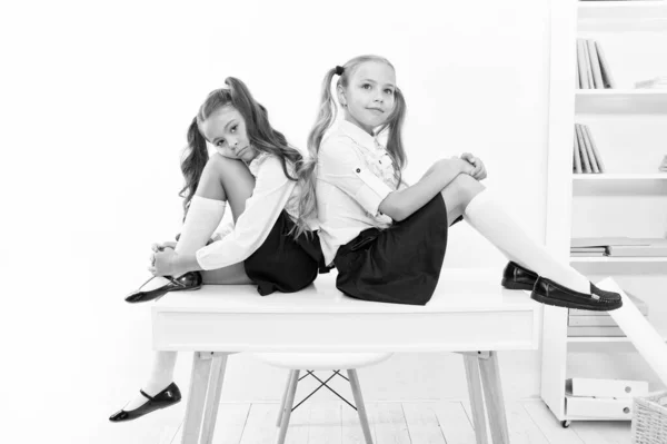 Informal and formal knowledge. Cute little schoolgirls having lesson on Knowledge day. Small children celebrating day of knowledge on September 1. Getting knowledge and skills at school — Stock Photo, Image