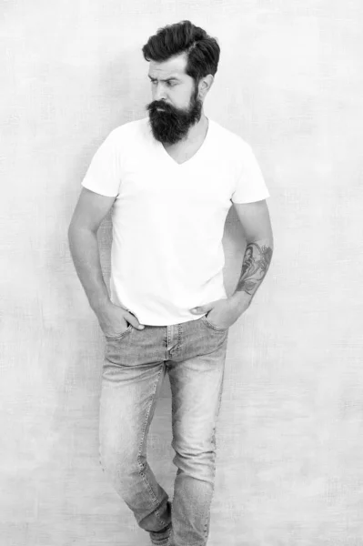 Casual style daily life. Simple and casual. Masculinity concept. Fashion and beauty. Hipster long well groomed beard and mustache. Male temper brutality. Brutal macho casual outfit gray background