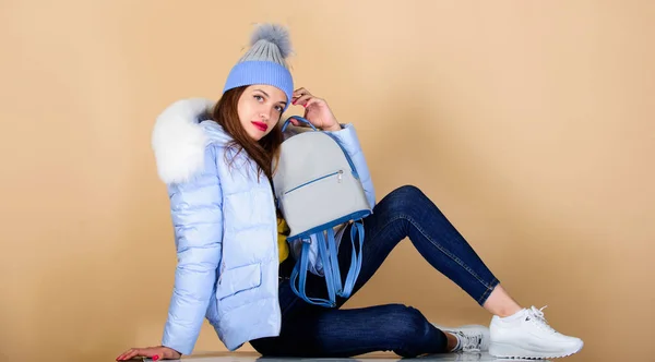 Time to rest. girl in puffed coat. faux fur fashion. warm winter clothing. shopping. woman in beanie hat with backpack. flu and cold season. Leather bag fashion. happy winter holidays — Stock Photo, Image