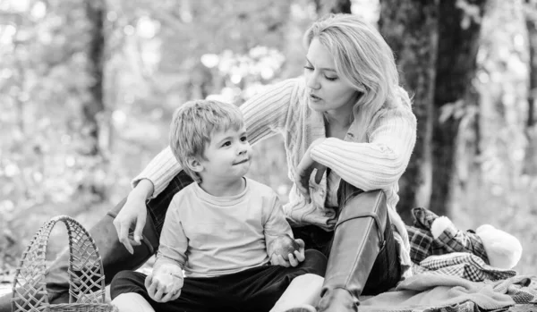 Natural beauty. Happy son with mother relax in autumn forest. Family picnic. Mothers day. Spring mood. Happy family day. Sunny weather. Healthy food. Mother love her small boy child — Stock Photo, Image