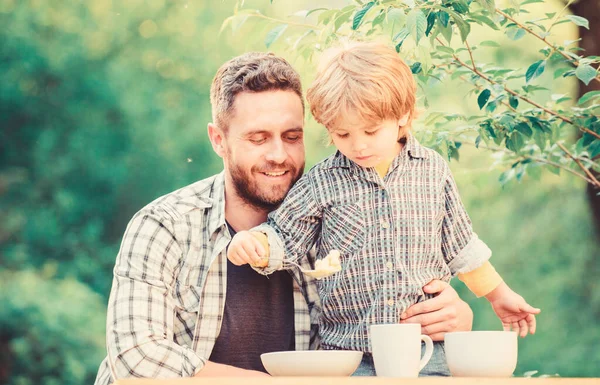 Everything is more fun with father. Organic nutrition. Healthy nutrition concept. Nutrition habits. Family enjoy homemade meal. Family time. Nutrition kids and adults. Little boy and dad eat — Stock Photo, Image