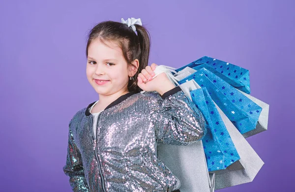 Kid fashion. shop assistant with package. Happy child. Little girl with gifts. Sales and discounts. Small girl with shopping bags. special offer. Holiday purchase saving. Textile shop. love this shop
