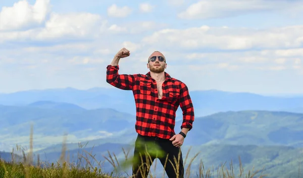 Power of nature. Man stand on top of mountain landscape background. Hiking concept. Discover world. Masculinity and male energy. Natural power. Masculine power. Tourist walking mountain hill