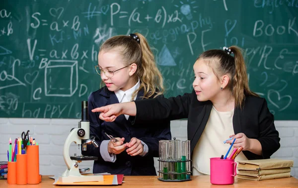 Chemistry experiment concept. Safety measures for providing safe chemical reaction. Make studying chemistry interesting. Basic knowledge of chemistry. Pupils cute girls use test tubes with liquids — Stock Photo, Image