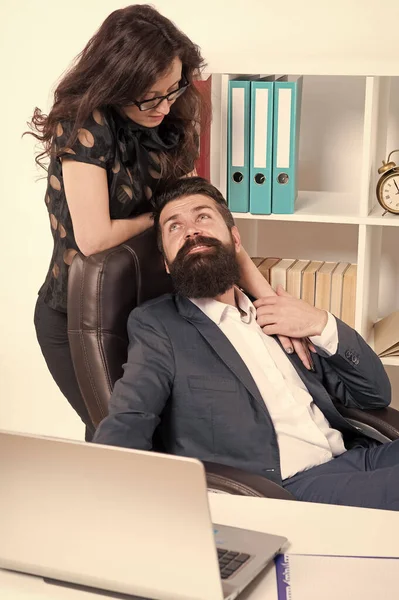 Love is everywhere. Love affair of businessman and sexy woman. Couple in love conducting affair at work. Boss and secretary having love relationship. Bearded man flirting with sensual woman in office