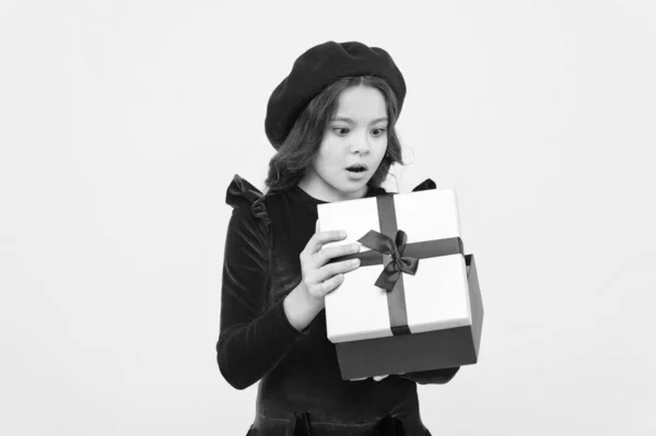 Successful shopping. small girl hold holiday gift. happy birthday. boxing day. parisian girl in french beret go shopping. autumn fashion. school fall season. surprised small girl with present box