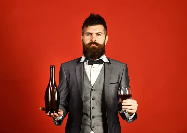 Winetasting and degustation concept. Connoisseur with serious face tasting merlot — Stock Photo, Image