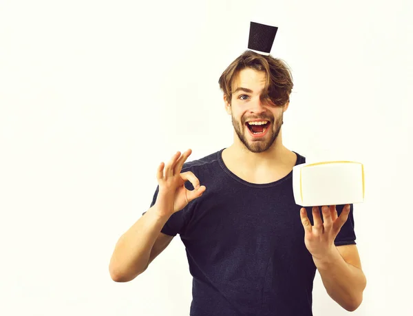 Caucasian sexy young macho holding male box with coffee cup — Stock Photo, Image