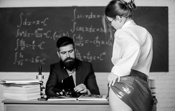 Seductive offer. Check knowledge. Desire for knowledge. Sex knowledge. Need for real experience. Teacher and student. Sexy seduction. Sexy butt red latex skirt in front of teacher. Private lesson — 스톡 사진