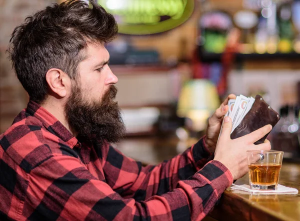 Guy spend leisure in bar, defocused background.