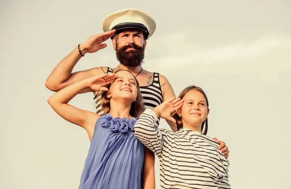 Summer travel concept. Happy family. Dad sailor and daughters outdoors. Captain welcome on board. Marine tour. Sea cruise. Handsome bearded sailor with kids. Travel around world. Travel by sea — Stock Photo, Image