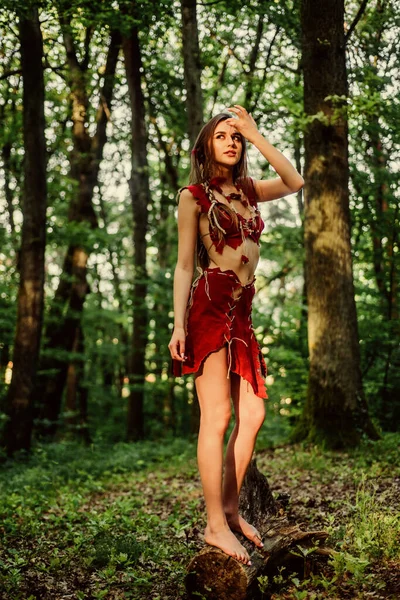 The woman went hunting. cougar female. wild woman in forest. ethnic tribal fashion. deep forest. sexy girl in leather suede clothes. amazon woman. sexy witch. Unpassable to resist — Stock Photo, Image