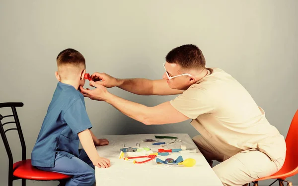 Medicine and health. happy child with father with stethoscope. small boy with dad play. Future career. father and son in medical uniform. nurse laboratory assistant. family doctor. doctos assistant — Stock Photo, Image